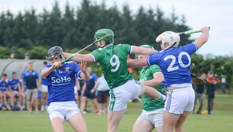 Ballincollig's Ross O'Donovan clashes with Ballinhassig's Charlie Grainger and Brian Lynch. Picture: hOward Crowdy