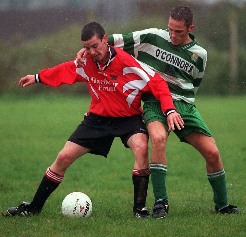 Leeside's Tom Gettings and Macroom's Timmy Corcoran battle for the ball in the AUL game in Little Island.Pic:Newspics Leeside's Tom Gettings and Macroom's Timmy Corcoran battle for the ball in the AUL game in Little Island.Pic:Newspics