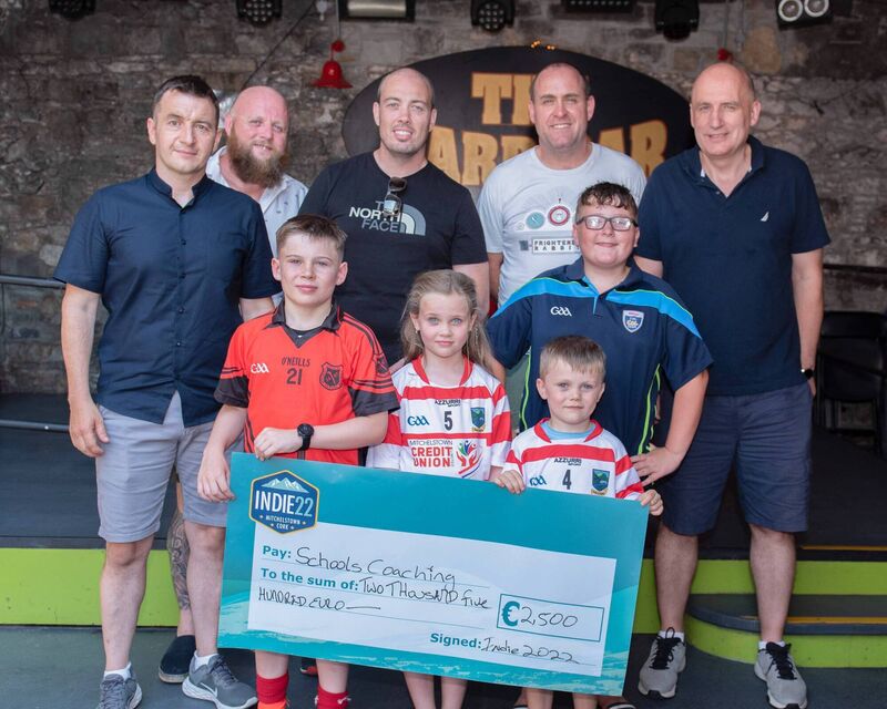 Presentation to Paul Horgan and Brian Burke on behalf of Schools Coaching Programme. L-R John Finn, Kieran Walsh, Paul Horgan, Mark Noonan, Brian Burke. Front row: Aaron Horgan, Saoirse Horgan, Dara Horgan and Daire Burke