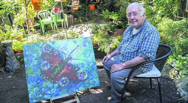 Neil Kelleher in his garden with one of his works of art. Picture: Dan Linehan