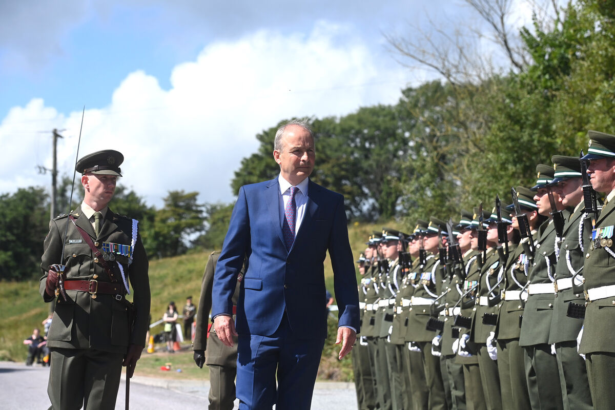 Taoiseach Micheál Martin inspects a guard of honour at the commemoration of the centenary of the death of Michael Collins. Picture: Larry Cummins
