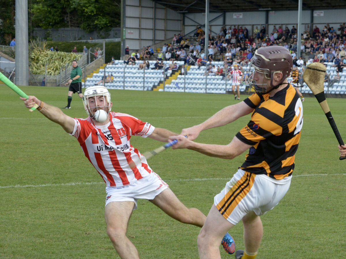 Avondhu's Eoghan Burke under pressure from Imokilly's Mike Kelly. Picture: Denis Boyle