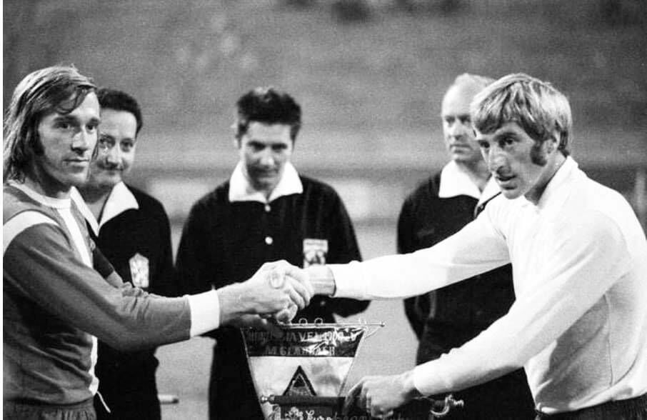 Dave Bacuzzi (Cork Hibernians), right, greets rival Borrusia Monchengladbach captain Gunter Netzer in 1971. Dave Bacuzzi (Cork Hibernians), right, greets rival Borrusia Monchengladbach captain Gunter Netzer in 1971.