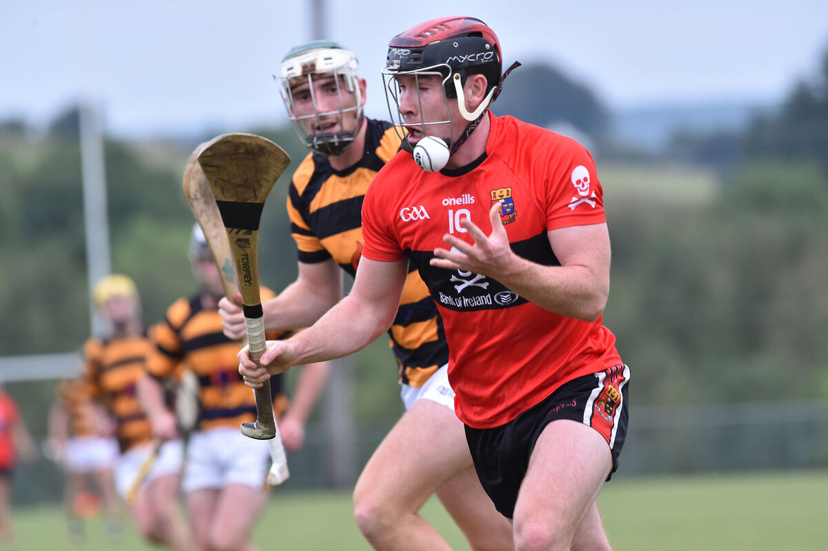  Eanna Desmond, UCC, going past Mark Keane, Avondhu during their Co-Op Superstores Cork Premier SHC clash at Mourneabbey. Picture: Dan Linehan