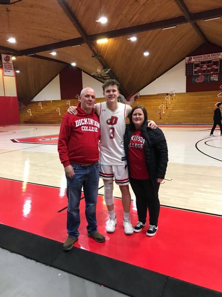 Adam and his parents Mar and Brian when he played in the US. Adam and his parents Mar and Brian when he played in the US.