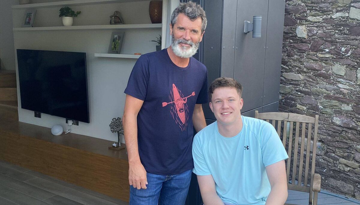 Soccer star Roy Keane with Adam Drummond on a recent visit to Adam’s home.