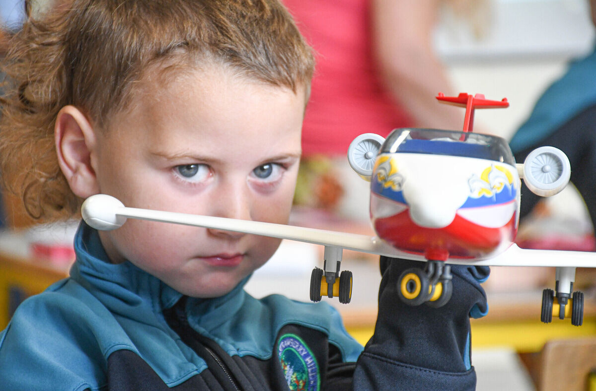 Paddy Courtney pictured with a toy plane on his first day in junior infants at Strawberry Hill NS