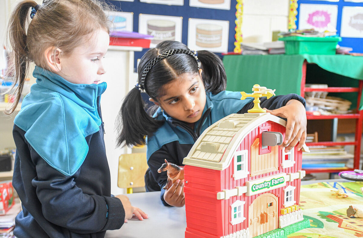 Ellie Dwyer and Andrea Binu seen playing with a Country Farm toy.