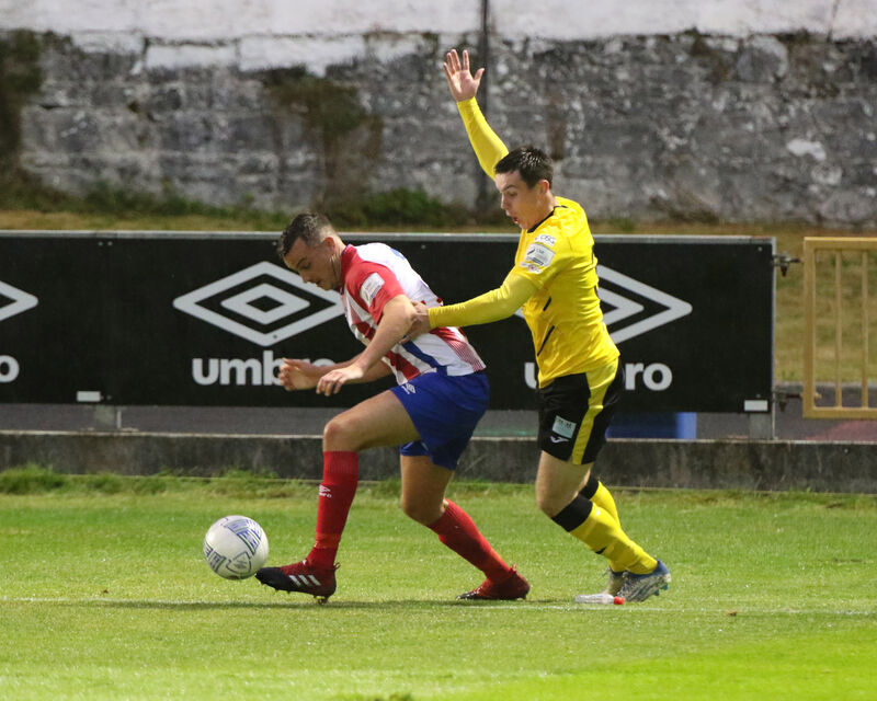Marc Ludden, Treaty United, under pressure from James O'Leary, Cobh Ramblers. Picture: Brendan Gleeson.