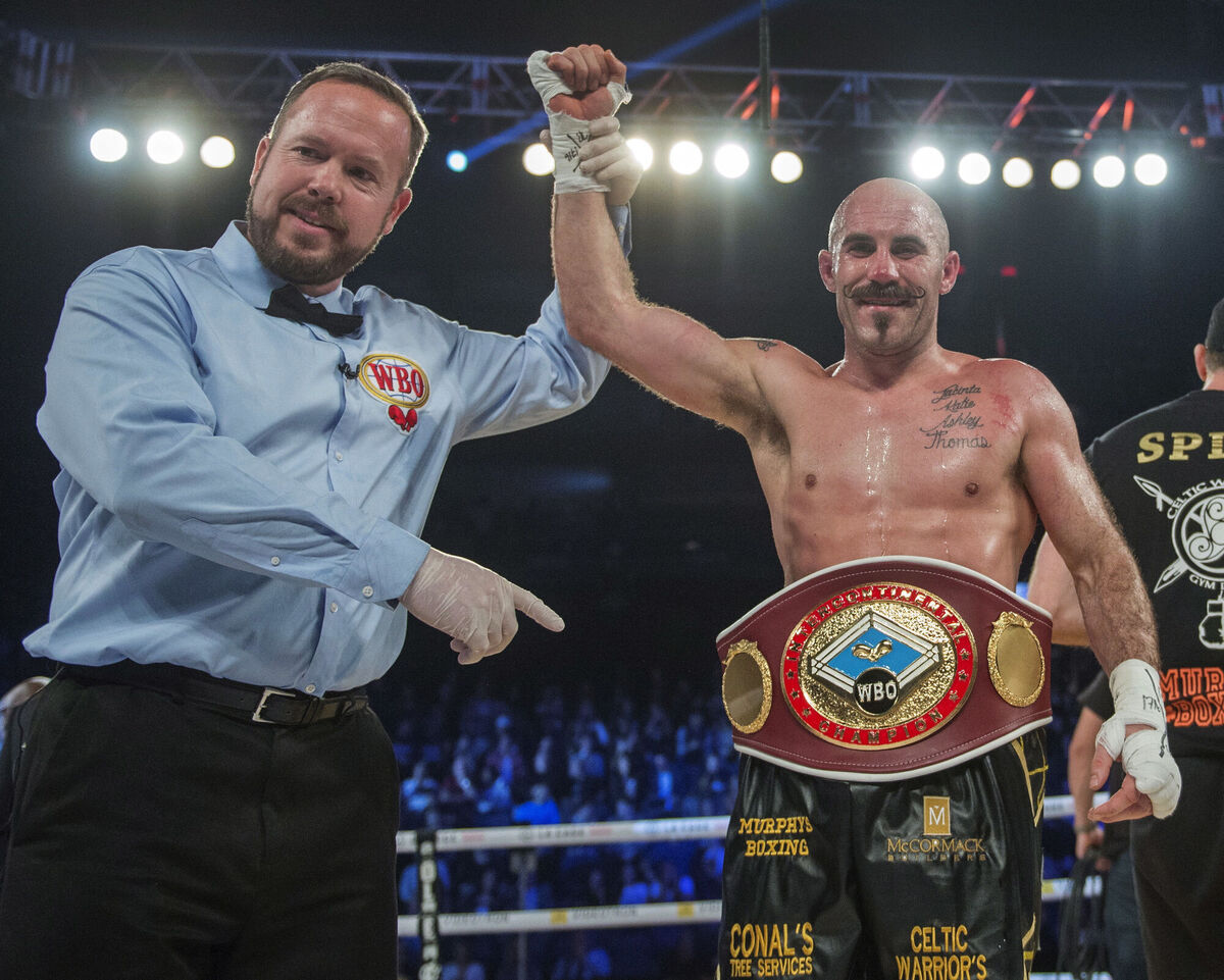 Gary O'Sullivan, of Ireland, gets the belt after knocking out Antoine Douglas, of the U.S., in the seventh round to win the WBO Intercontinental middleweight boxing championship fight in Laval, Quebec, Saturday, Dec. 16, 2017. (Ryan Remiorz/The Canadian Press via AP)