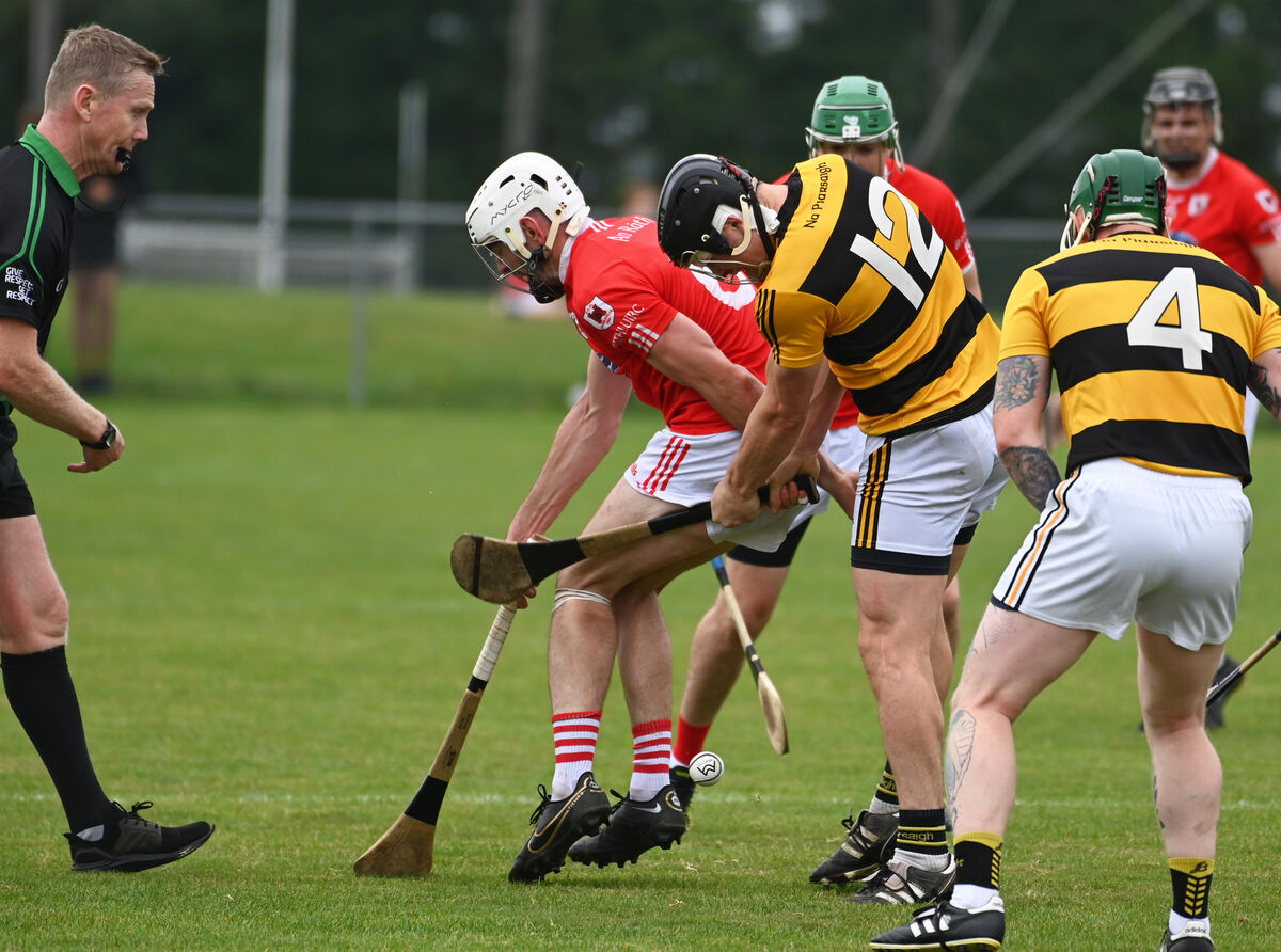Charleville's Jack Buckley feels the force of Na Piarsaigh's Patrick Rourke's hurley. Picture: Eddie O'Hare