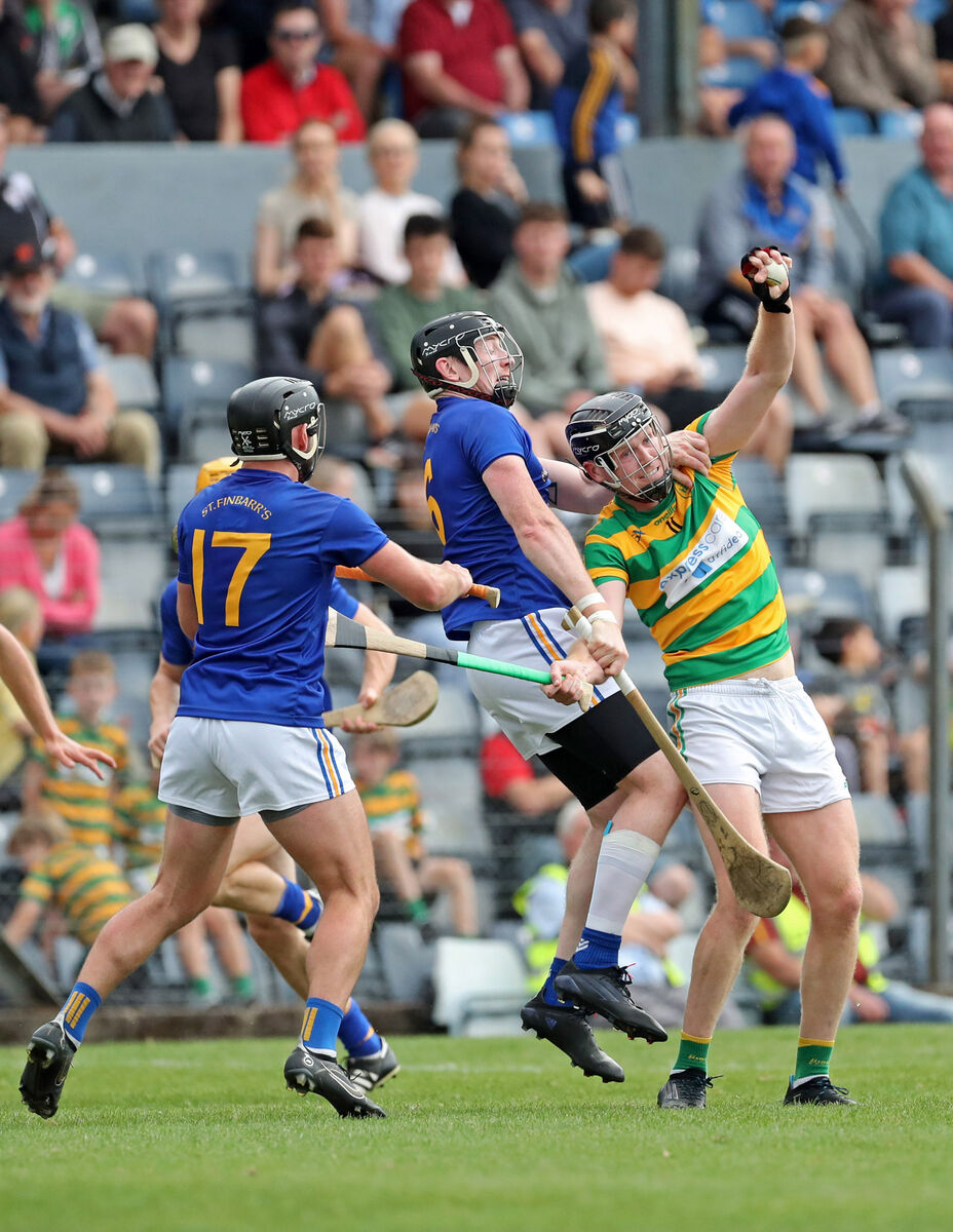  Shane O'Keeffe, Blackrock, catches the sliotar from Glenn O'Connor and Damien Cahalane, St Finbarr's. Picture: Jim Coughlan.