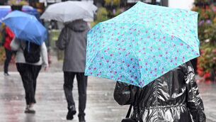 <p class="contextmenu internal_Caption">People braving the elements during a heavy shower in Cork last week. We needed the downpours, says Kathriona Devereux</p>