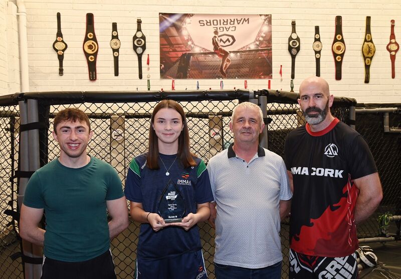 Louise Brady with Arann Maguire, head coach, MMA Cork, (left); Eamonn Scully, striking coach, (right) and Louise's father James Brady. Picture: Denis Minihane. Louise Brady with Arann Maguire, head coach, MMA Cork, (left); Eamonn Scully, striking coach, (right) and Louise's father James Brady. Picture: Denis Minihane.
