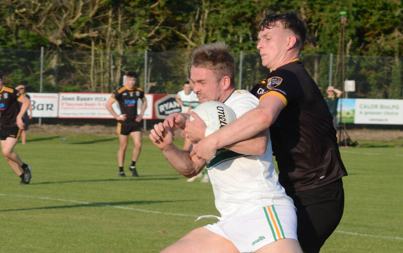 St Michael's Alan O'Callaghan is challenged by Fermoy's Padraig De Roiste. Picture: Howard Crowdy