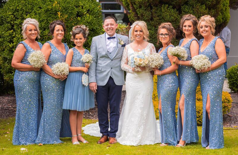 Bride and groom Sandra and Michael with bridesmaids and junior bridesmaids on their special day.