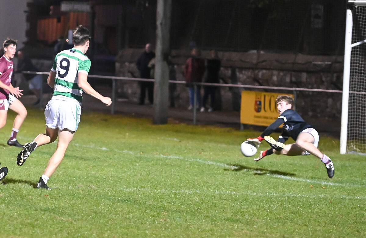 Bishopstown's Sean Cronin makes a superb save to deny Valley Rovers' Daniel Lynch during the Rebel Óg Premier 1 MFC semi-final at the Mardyke. Picture: David Keane. Bishopstown's Sean Cronin makes a superb save to deny Valley Rovers' Daniel Lynch during the Rebel Óg Premier 1 MFC semi-final at the Mardyke. Picture: David Keane.