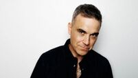 Robbie Williams becomes solo artist with most UK number one albums