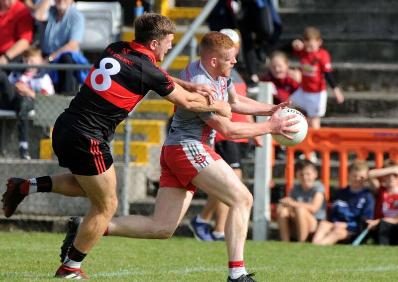 Mitchelstown's Pa Magee tackles Dromtarriffe's Conor O'Callaghan. Picture: Denis Minihane.