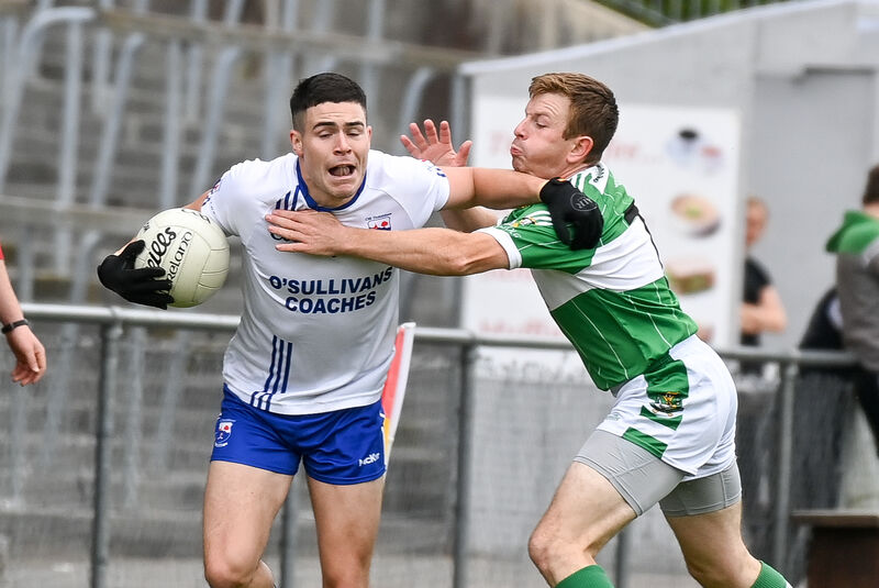 Kildorrery's Darren MacNamara is tackled by Aghabullogue's Denis Quinlan. Picture: David Keane Kildorrery's Darren MacNamara is tackled by Aghabullogue's Denis Quinlan. Picture: David Keane