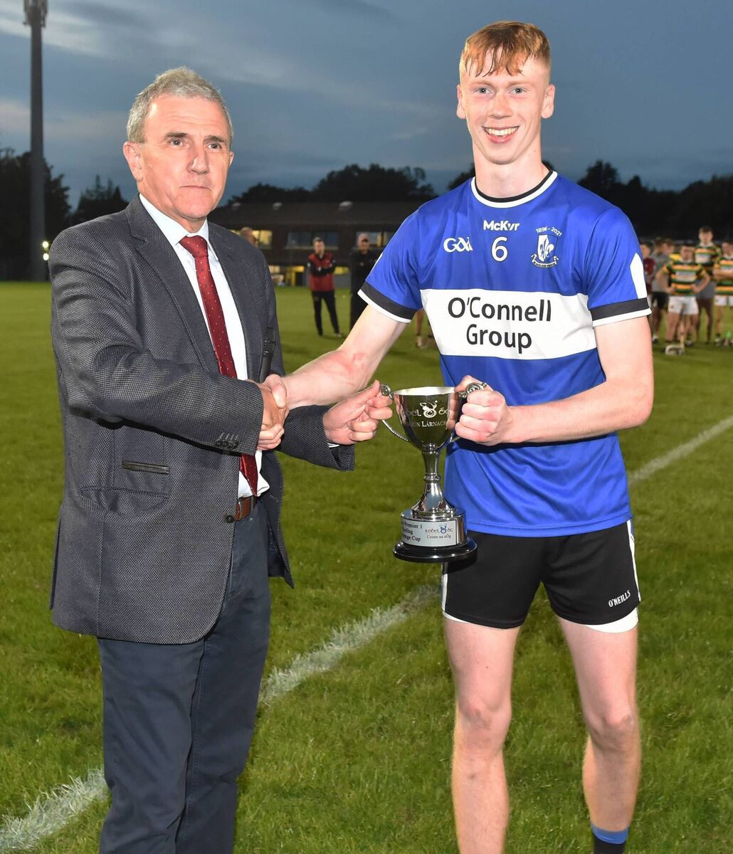 Michael O'Mahony, chairman Rebel Og presents the trophy to Sarsfields' captain John Leddy after defeating in the Rebel Og Premier 1 hurling championship challenge cup final at Pairc Ui Rinn. Picture; Eddie O'Hare Michael O'Mahony, chairman Rebel Og presents the trophy to Sarsfields' captain John Leddy after defeating in the Rebel Og Premier 1 hurling championship challenge cup final at Pairc Ui Rinn. Picture; Eddie O'Hare