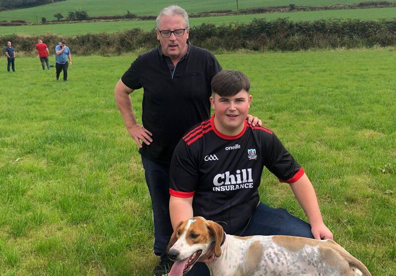 Sean and John O'Sullivan of Griffin United with Sean T winner of the All-Ireland Puppy draghunt at Ballinspittle.