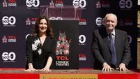 Bond producers praise 007 team as they cement their handprints in Hollywood