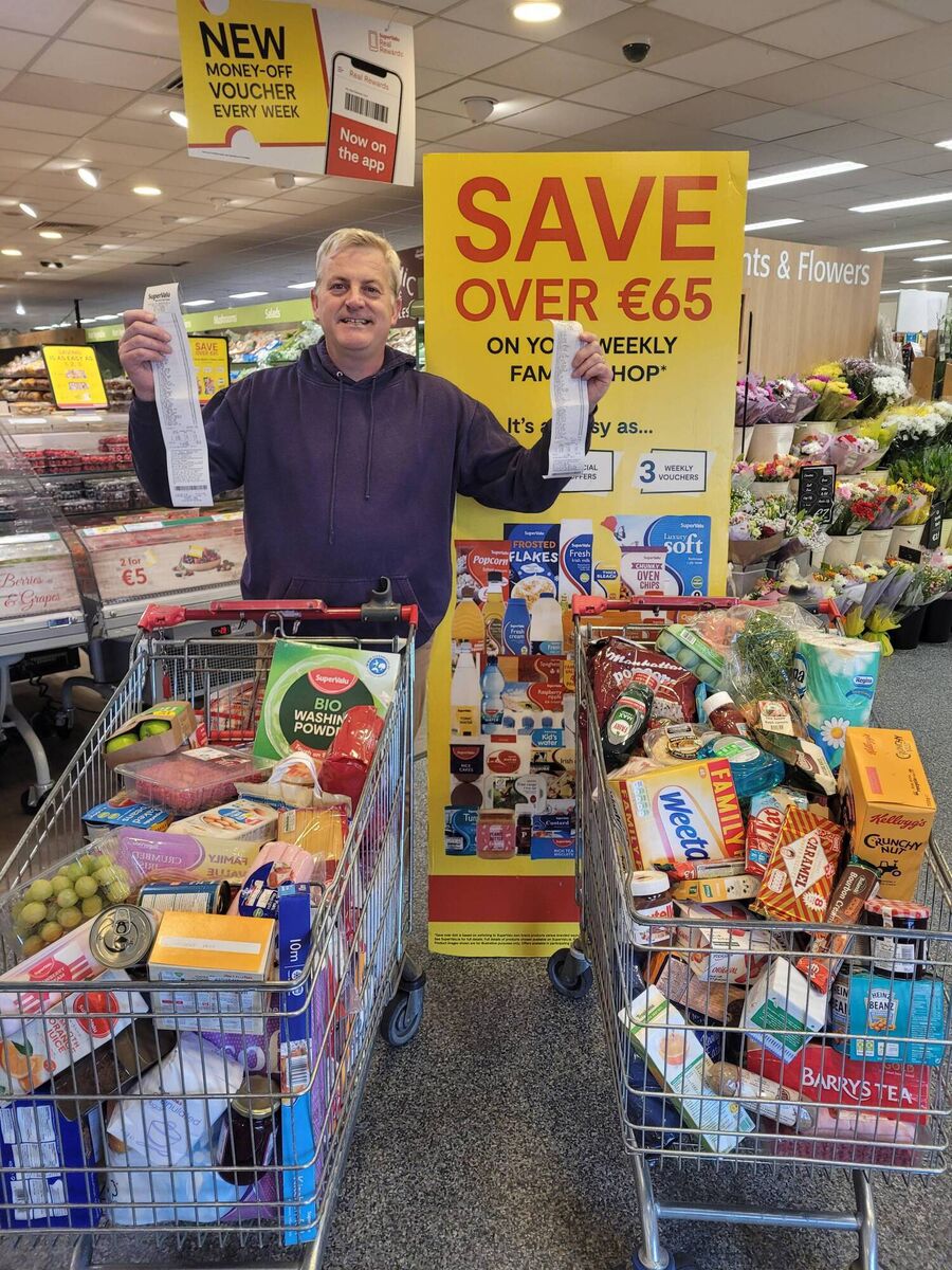 John Dolan with his recipes, showing the difference between buying branded and own-brand goods, in SuperValu.