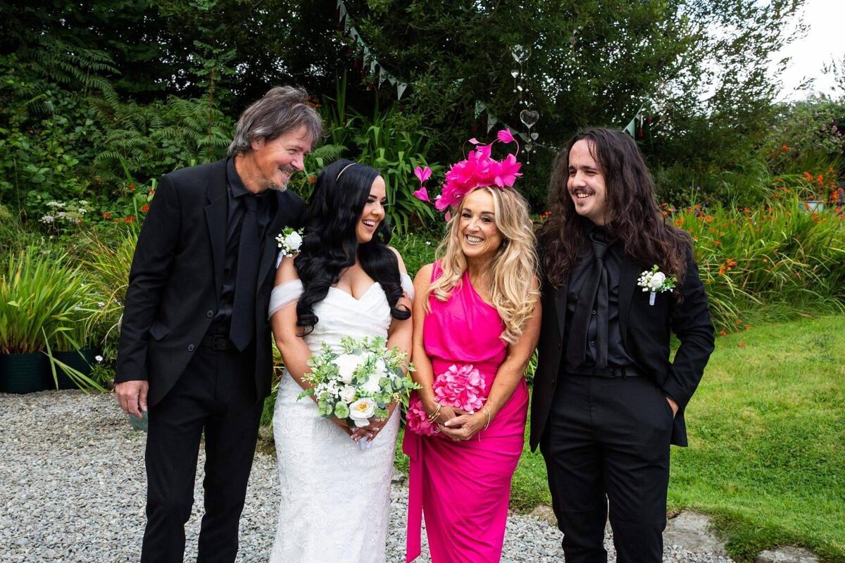 Molly pictured with her father Derry, her mother Deborah and her brother Lewis.