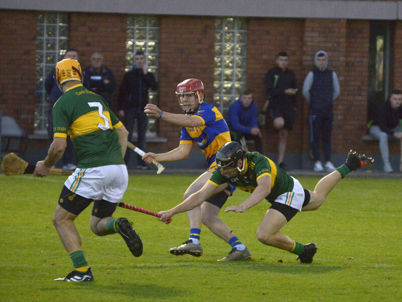 Cloughduv's Liam Kelleher battling Lisgoold's James O'Driscoll. Picture: Denis Boyle