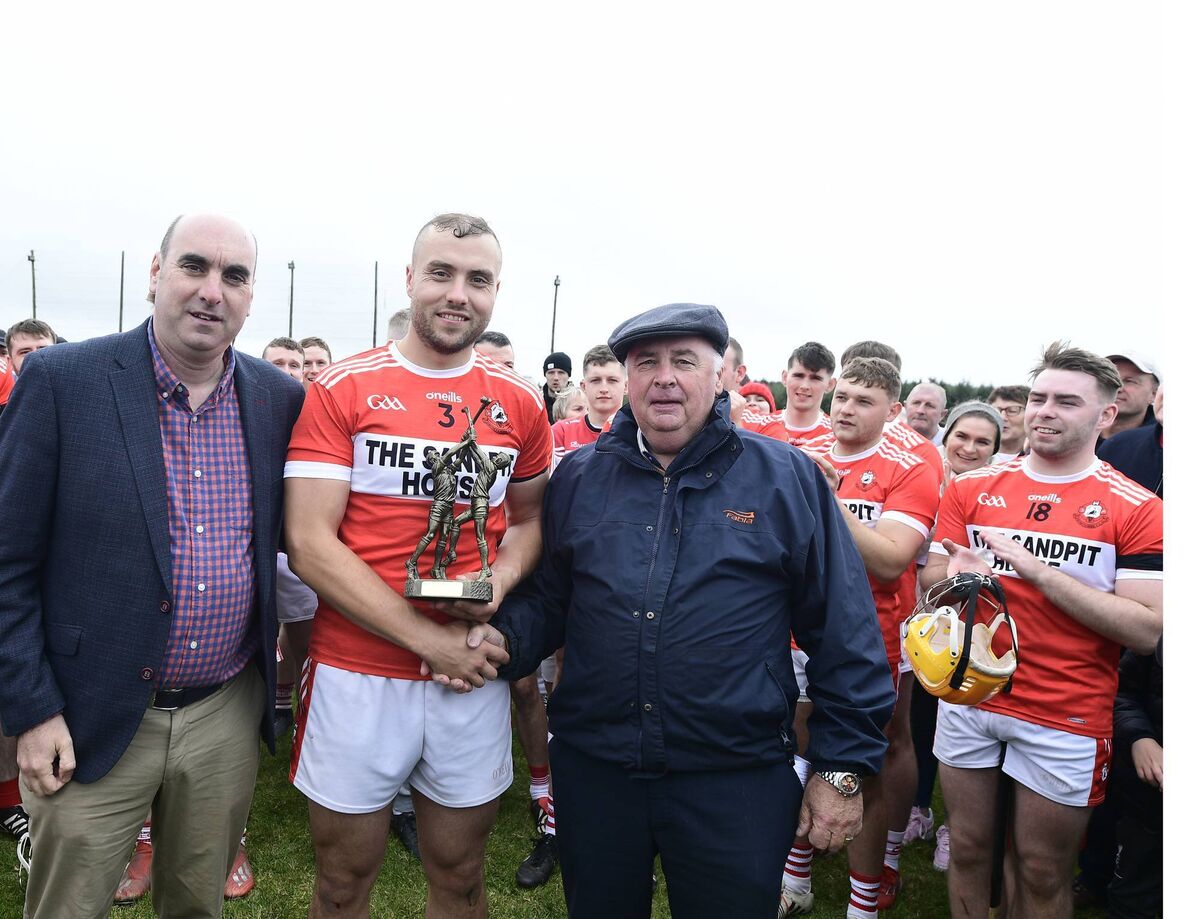 Dromtarriffe's Michael O'Brien receives the man of the match award from Eamon Tarrant after his side's victory in the Duhallow JAHC Final. Picture John Tarrant 