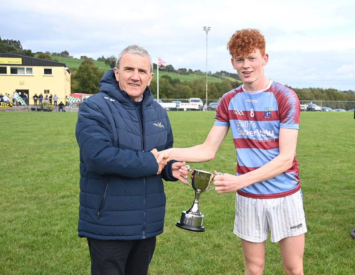  Micheal O'Mahony, chairperson, Rebel Óg makes the cup presentation to Luke Murphy, captain of Ibane Gaels. Picture: Larry Cummins 