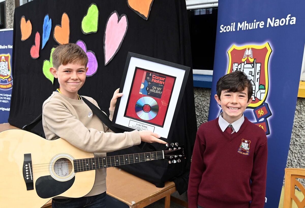 Conor Nolan at the launch of his debut single, On my holiday, at Scoil Mhuire Naofa, Carrigtwohill, which won the school's song writing competition 2022 when he was in sixth class, pictured with his brother Luke. Picture Denis Minihane.
