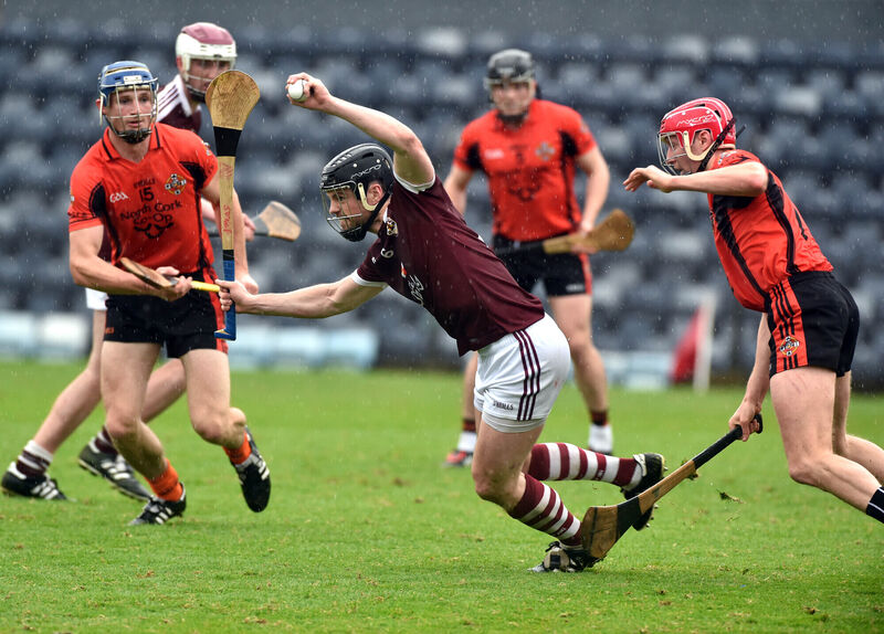 Bishopstown's Shane O'Neill breaks from Duhallow's Gareth Linehan and Lorcán McLoughlin. Picture: Eddie O'Hare
