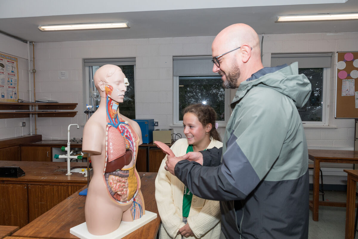 Leaon Tag with his daughter in the science lab during the open night which was held in St. Peter's Community School in Passage West, Co. Cork. - Picture David Creedon