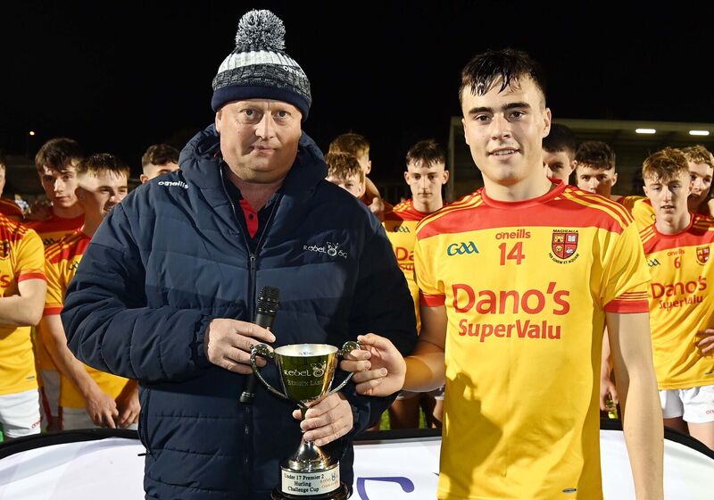 Peter Watson, vice-chairman, Rebel Óg, presenting the cup to Mallow captain Billy Murphy. Picture Denis Minihane.