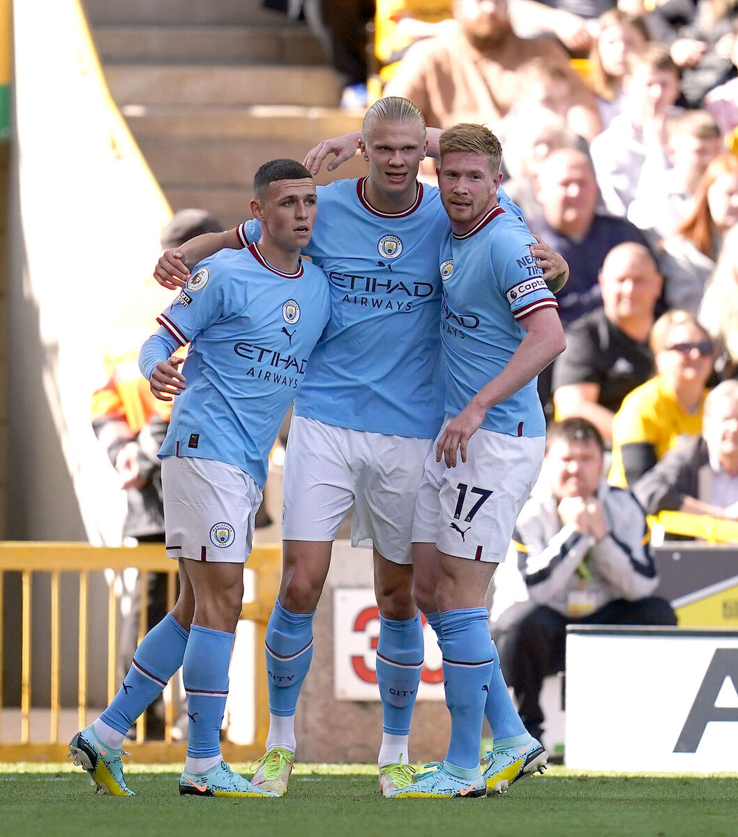 Manchester City's Erling Haaland celebrates scoring their side's second goal of the game with team-mates Phil Foden (left) and Kevin De Bruyne (right) during the Premier League match at Molineux Stadium, Wolverhampton.  Picture: Nick Potts/PA Wire.