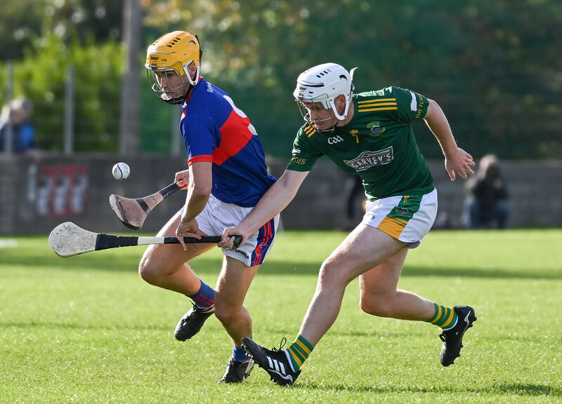  Cobh's Paidi Kearney and Erin's Own's Andrew O'Sullivan in a race for the ball. Picture: David Keane