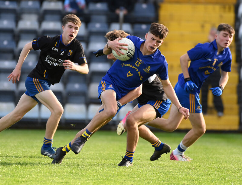 St Finbarr's John Wiggington-Barrett breaking through the Carrigaline defence during the Rebel Óg Premier 2 Minor Football final at Páirc Uí Rinn. Picture: Eddie O'Hare