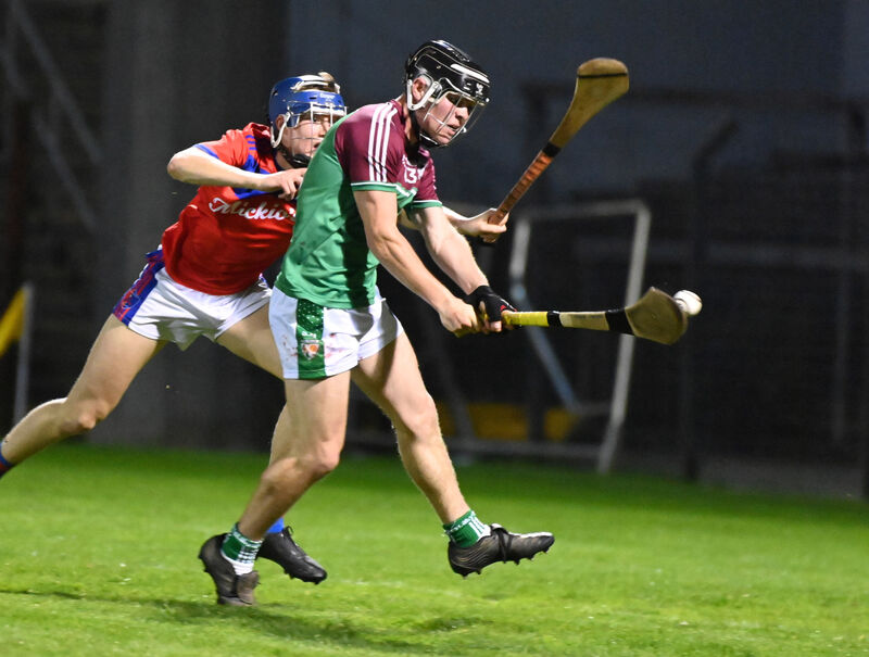 Killeagh's Sean Meade strikes the winning goal from Erin's Own's Donnacha Collins in the Rebel Óg Premier 2 Minor hurling final. Picture: Eddie O'Hare
