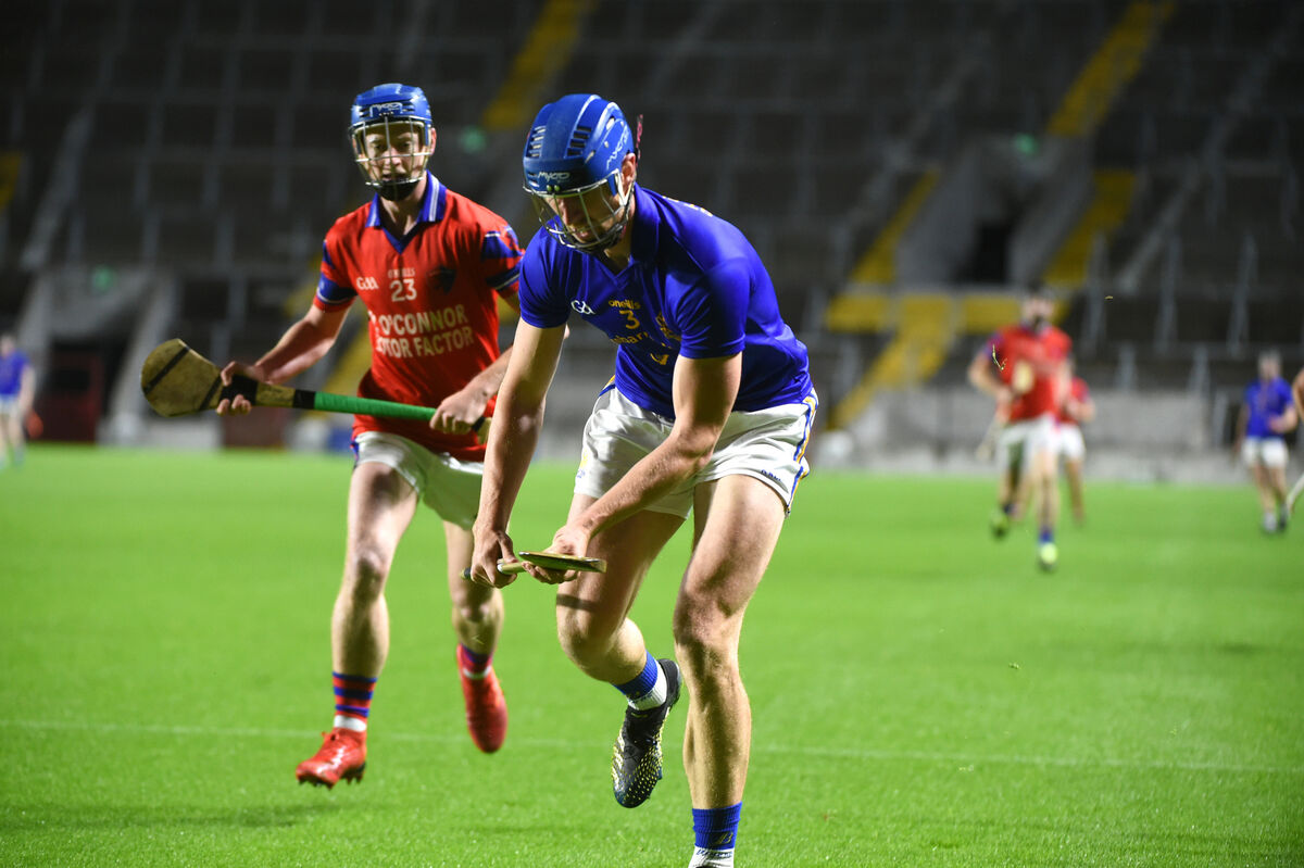  St Finbarr's defender Jamie Burns chases possession as Cian O'Callaghan, Erin's Own keeps the pressure on. Picture: Larry Cummins.