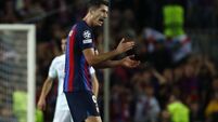 Robert Lewandowski scores late equaliser to give Barcelona Champions League hope