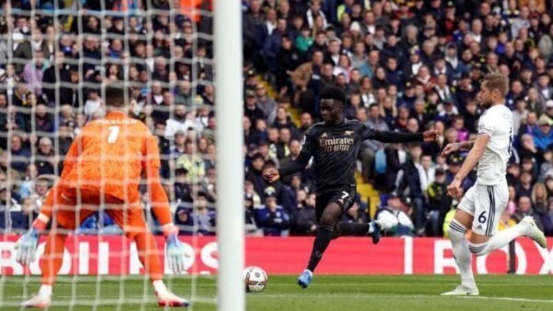 Bukayo Saka fires Arsenal to win as league leaders survive late scare at Leeds