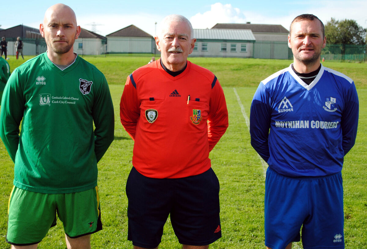 Glenthorn Celtic B's captain Robbie Coade (left) with Blackstone Rovers' Michael Twohig, accompanied by referee Billy Noonan. Glenthorn Celtic B's captain Robbie Coade (left) with Blackstone Rovers' Michael Twohig, accompanied by referee Billy Noonan.