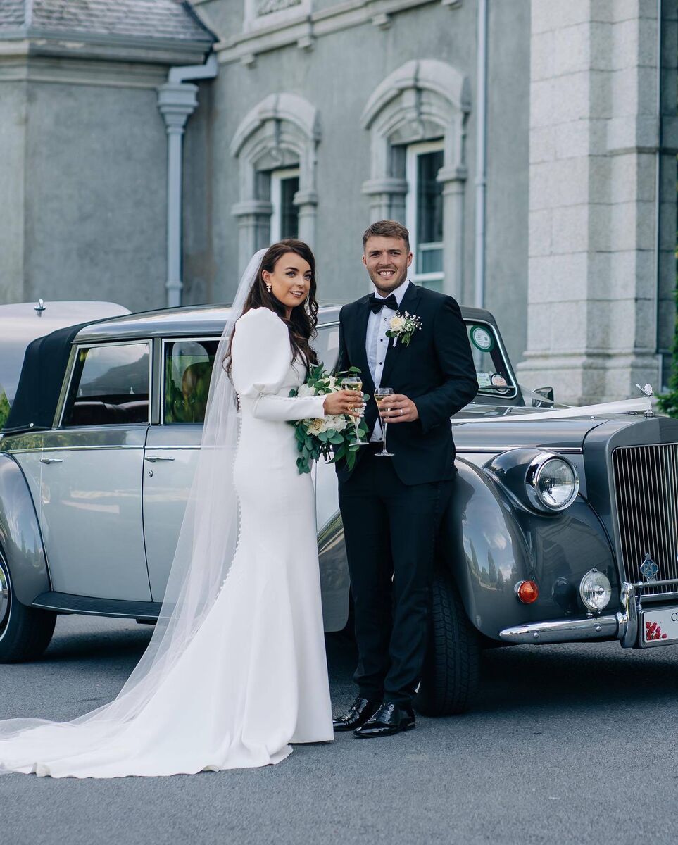The couple with their wedding car, outside Faithlegg House Hotel, where they enjoyed their wedding reception surrounded by family and friends. The couple with their wedding car, outside Faithlegg House Hotel, where they enjoyed their wedding reception surrounded by family and friends.