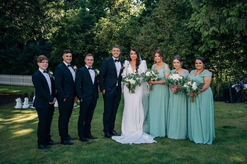 The happy couple, Chloe Walsh and Mark Coady, with their wedding party, made up of sisters and also cousins.