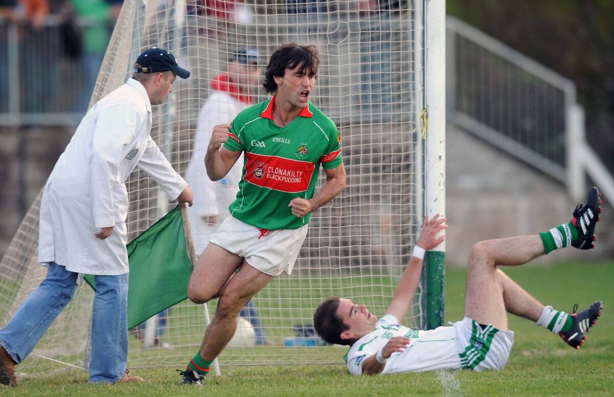 The umpire reaches for the green flag as Clonakilty forward Padraigh Griffin celebrates the first of his two goals against Ilen Rovers. Picture: Des Barry The umpire reaches for the green flag as Clonakilty forward Padraigh Griffin celebrates the first of his two goals against Ilen Rovers. Picture: Des Barry