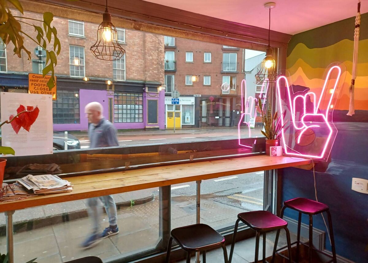 The neon pink hand saluting Washington Street. Picture: Richard Gordon