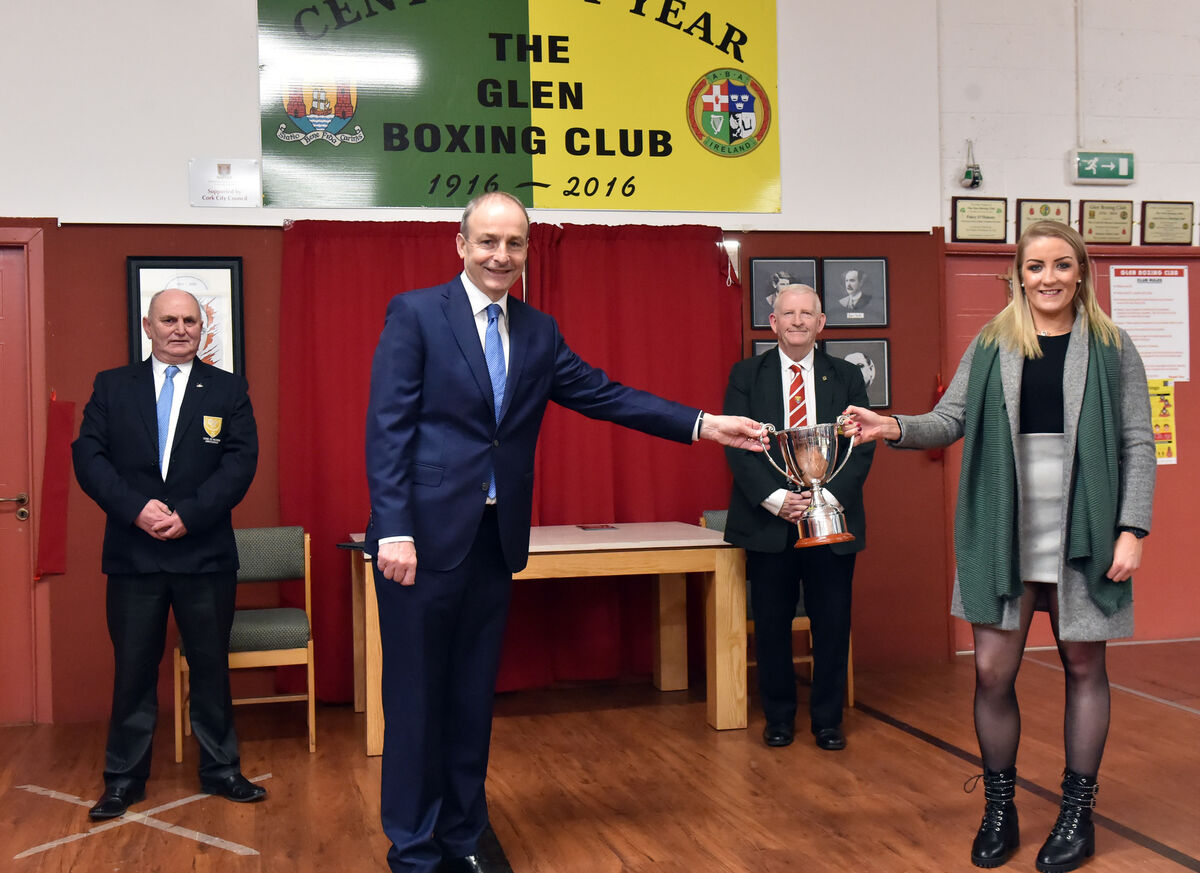An Taoiseach Michéal Martin at The Glen Boxing club where he presented his father's cup The Paddy 'The Champ' Martin cup to Christine Desmond, winner of the champions cup with Mick O'Brien, President Cork County Boxing Board and Paddy McSweeney, President Cork Ex Boxers Association