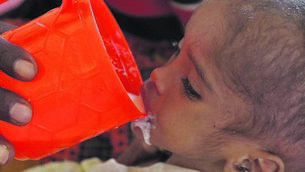 <p class="contextmenu internal_Caption">A Somali man feeds his child at a field hospital in Dadaab, Kenya, during the 2011 crisis in Somalia. The country is stricken again</p>
